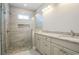 Modern bathroom featuring a glass-enclosed shower and double sink vanity with granite countertop at 8125 Living Tide Dr., Myrtle Beach, SC 29572