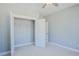 A simple carpeted bedroom features an open closet with wire shelving and white trim at 8125 Living Tide Dr., Myrtle Beach, SC 29572