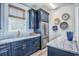 Kitchenette features navy cabinets, marble counters, gold hardware and stainless steel refrigerator at 8125 Living Tide Dr., Myrtle Beach, SC 29572