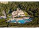 Stunning aerial view of the community clubhouse, pools, and surrounding green space at 8156 Living Tide Dr., Myrtle Beach, SC 29572