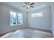 Bedroom featuring hardwood floors, natural light, and ample closet space at 8156 Living Tide Dr., Myrtle Beach, SC 29572