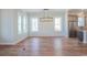 Open-concept dining area featuring hardwood floors, natural light, and stainless steel appliances at 8156 Living Tide Dr., Myrtle Beach, SC 29572