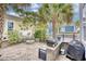 Backyard patio area with a built-in grill and gas fire pit for outdoor entertaining at 843 Howard Ave., Myrtle Beach, SC 29577