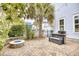 Paver patio with built in gas grill, a fire pit and a surrounding garden with privacy fence at 843 Howard Ave., Myrtle Beach, SC 29577