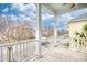 Charming balcony featuring white railings with views of the neighborhood and scenic blue skies at 843 Howard Ave., Myrtle Beach, SC 29577