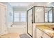 Bright bathroom featuring a soaking tub, glass enclosed shower and granite counters at 843 Howard Ave., Myrtle Beach, SC 29577