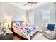Comfortable bedroom featuring a ceiling fan, accent chair and bright natural light at 843 Howard Ave., Myrtle Beach, SC 29577