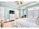 Bright bedroom with a ceiling fan, a TV on a stand, and a desk near a window at 843 Howard Ave., Myrtle Beach, SC 29577