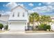 Bright two-story home with a spacious two-car garage and well-maintained yard with lovely palm trees at 843 Howard Ave., Myrtle Beach, SC 29577