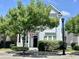 Charming two-story home with a well-manicured lawn and inviting front porch with an American flag at 843 Howard Ave., Myrtle Beach, SC 29577
