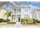 Charming two-story home features a welcoming double porch, lush landscaping and classic architectural details at 843 Howard Ave., Myrtle Beach, SC 29577