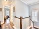 Upstairs hallway with wood floors and bright blue walls leading to other rooms at 843 Howard Ave., Myrtle Beach, SC 29577