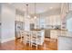 Spacious kitchen featuring a large island with seating, stainless steel appliances, and hardwood floors at 843 Howard Ave., Myrtle Beach, SC 29577