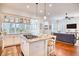 Spacious kitchen seamlessly flows into the living room and features an island with a gas cooktop at 843 Howard Ave., Myrtle Beach, SC 29577
