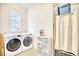 Functional laundry room with modern washer and dryer, plus storage and natural light at 843 Howard Ave., Myrtle Beach, SC 29577