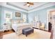 Serene main bedroom with a tray ceiling, ceiling fan, natural light, and stylish furniture at 843 Howard Ave., Myrtle Beach, SC 29577
