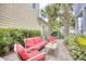 Backyard patio features comfortable outdoor seating amid lush landscaping at 843 Howard Ave., Myrtle Beach, SC 29577