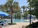 Community pool with chairs and umbrellas for relaxing at 843 Howard Ave., Myrtle Beach, SC 29577