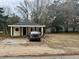 Single story home featuring a cozy porch and private driveway at 901 4Th Ave. N, Myrtle Beach, SC 29577