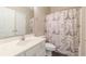 Bathroom features a vanity with a white countertop, toilet, and Paris-themed shower curtain at 901 West Port Dr. # 1807, North Myrtle Beach, SC 29582