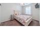 Cozy bedroom features neutral paint, window, and coastal-themed comforter, creating a relaxing atmosphere at 901 West Port Dr. # 1807, North Myrtle Beach, SC 29582