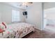 Well-lit bedroom features modern TV, neutral paint, coastal-themed bedspread, and comfortable furnishings at 901 West Port Dr. # 1807, North Myrtle Beach, SC 29582