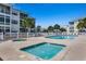 Community pool area with two hot tubs, lounge chairs, and manicured landscaping at 901 West Port Dr. # 1807, North Myrtle Beach, SC 29582