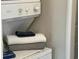 Close-up of stacked washer and dryer with folded towels on top at 901 West Port Dr. # 1807, North Myrtle Beach, SC 29582