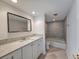 Bathroom features a vanity sink and a tub with grey tile at 9650 Shore Dr. # 706, Myrtle Beach, SC 29572