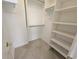 Walk-in closet providing ample storage, shelving, and rod for organizing at 9650 Shore Dr. # 706, Myrtle Beach, SC 29572