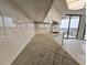 The kitchen features marble countertops, white cabinetry, and stainless steel fixtures set against a balcony backdrop at 9650 Shore Dr. # 706, Myrtle Beach, SC 29572