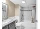 Bathroom featuring marble tile, a shower-tub combo, and a granite vanity at 9840 Queensway Blvd. # 1207, Myrtle Beach, SC 29572