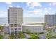 Exterior shot of beachfront condo complex with ocean view and manicured landscaping at 9840 Queensway Blvd. # 1207, Myrtle Beach, SC 29572