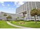 Exterior building view with palm trees and walkway at 9840 Queensway Blvd. # 1207, Myrtle Beach, SC 29572