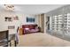 Cozy living room with balcony access, featuring wood-look flooring, modern lighting, and ocean views at 9840 Queensway Blvd. # 1207, Myrtle Beach, SC 29572