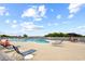 Resort-style swimming pool with lounge chairs and tables on a sunny day at 9840 Queensway Blvd. # 1207, Myrtle Beach, SC 29572