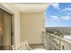 Outdoor balcony with furniture overlooking green trees on a clear day at 9994 Beach Club Dr. # 1601, Myrtle Beach, SC 29572