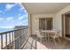 Condo balcony with a table, four chairs, and expansive ocean views at 9994 Beach Club Dr. # 1601, Myrtle Beach, SC 29572