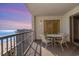 Balcony overlooking the beach with a table, four chairs, and sunset views at 9994 Beach Club Dr. # 1601, Myrtle Beach, SC 29572