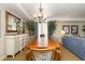 Dining area with large wooden table and seating for eight, with lots of natural light at 9994 Beach Club Dr. # 1601, Myrtle Beach, SC 29572