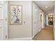 Hallway with neutral walls and carpet leading to the condo's living and dining areas at 9994 Beach Club Dr. # 1601, Myrtle Beach, SC 29572