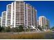 Exterior of condo buildings with balconies and view of the ocean at 101 Ocean Creek Dr. # Dd-9, Myrtle Beach, SC 29572