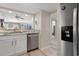 Galley kitchen with stainless steel appliances and views into the living area at 101 Ocean Creek Dr. # Dd-9, Myrtle Beach, SC 29572