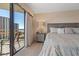 Balcony views enhance this main bedroom with balcony access, cozy textures, and natural light at 101 Ocean Creek Dr. # Dd-9, Myrtle Beach, SC 29572