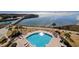 Aerial view of a community pool and lounge chairs overlooking the beach at 101 Ocean Creek Dr. # Dd-9, Myrtle Beach, SC 29572