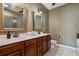 Elegant bathroom boasts double sinks, and decorative mirrors at 10-1 Rattan Circle # 1, Pawleys Island, SC 29585