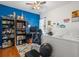 Comfortable bedroom featuring hardwood floors, decorative blue wall, and ceiling fan at 10-1 Rattan Circle # 1, Pawleys Island, SC 29585