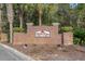 Rose Run community brick signage surrounded by mature landscaping at 10-1 Rattan Circle # 1, Pawleys Island, SC 29585