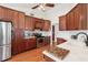 Kitchen featuring wood cabinets, stainless appliances, and marble backsplash at 10-1 Rattan Circle # 1, Pawleys Island, SC 29585