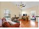 Living room with ceiling fan, vaulted ceiling, hardwood floors and view to bedroom at 10-1 Rattan Circle # 1, Pawleys Island, SC 29585